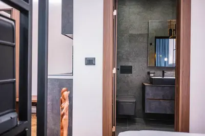 a bathroom with a sink and a mirror at Giardino Lux Apartments in Ulcinj