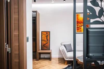 a living room with a couch and a chair at Giardino Lux Apartments in Ulcinj