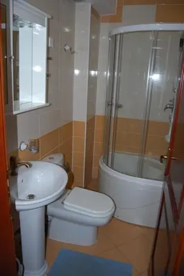 a bathroom with a toilet and a shower and a sink at villa elkom-appartamento giallo 1 in Ulcinj