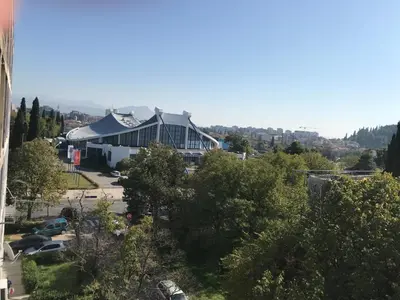 a view of a building with a parking lot at SunFlat Podgorica - Novakovic Residence in Podgorica
