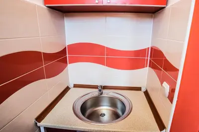a small bathroom with a stainless steel sink at Villa Elkom, App.3 in Ulcinj