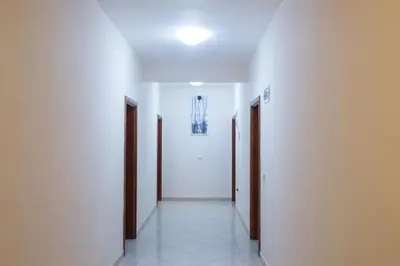 an empty hallway with two doors and a hallwayngthngthngthngthngthngthngth at Villa Elkom, App.4 in Ulcinj