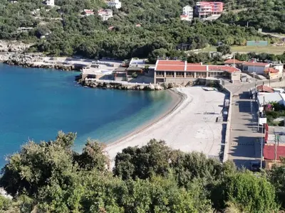 a view of a beach with buildings and the water at STUDIO Carpe Diem in Utjeha