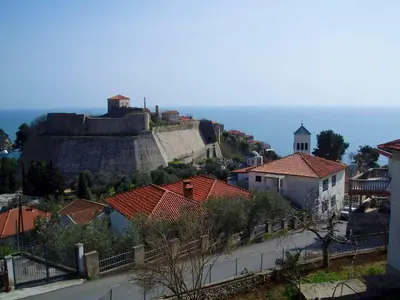a town with a castle on top of a hill at Sea View Apartment Ulcinj 80 m² in Ulcinj