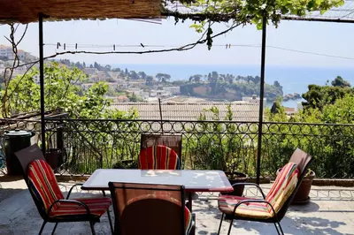 a table and chairs with a view of the ocean at Sea View Apartment Ulcinj 80 m² in Ulcinj