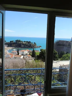 a view of the ocean from a window at Comfortable Apartment in Ulcinj with Sea View and Garden in Ulcinj