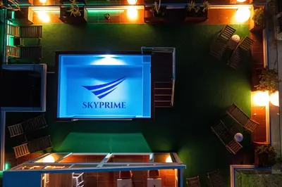 a television on a green wall with a sign on it at Villa Skyprime in Budva