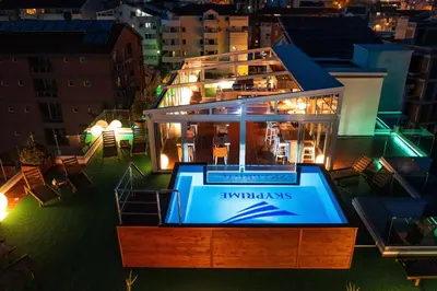 a house on top of a city at night at Villa Skyprime in Budva