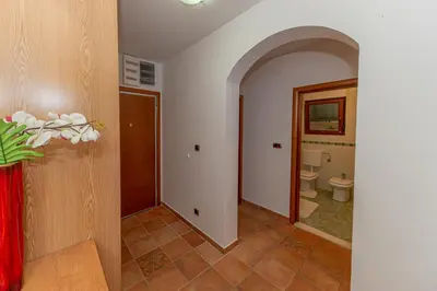 a hallway with a bathroom with a toilet at Apartment Qservice Petrovac in Budva