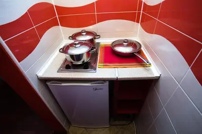 a small kitchen with two pots on a counter at Villa Elkom, Ap 15 in Ulcinj