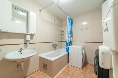 a bathroom with a sink and a toilet and a sink at Montenegro Hostel 4U in Kotor