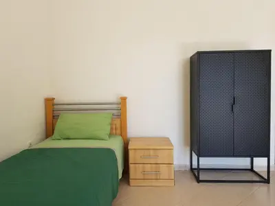 a bedroom with a bed and a television at Villa Alisa in Dobra Voda