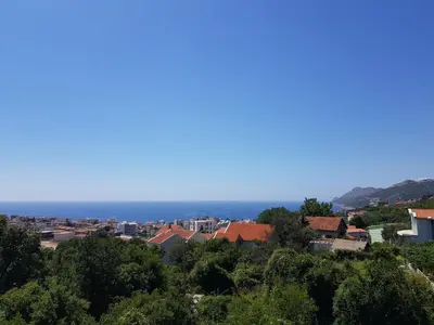 a view of a city with the ocean in the background at Villa Alisa in Dobra Voda