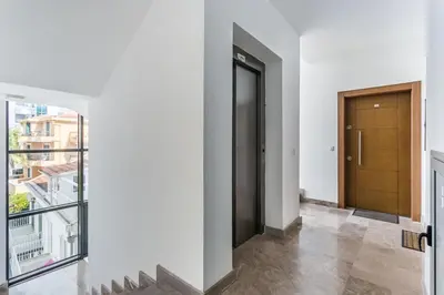 a hallway with a door and a balcony at Apartments BEATRICE Rafailovici in Rafailovici
