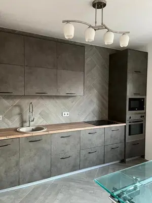 a kitchen with a sink and a counter top at Апартаменты Anturage с отдельным входом in Dobra Voda