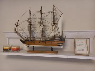 a model of a ship sitting on a shelf at Egon Apartments in Budva