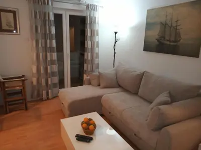 a living room with a couch and a table at Apartman Bojana in Bar