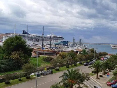 a cruise ship is docked in a harbor at Apartman Bojana in Bar