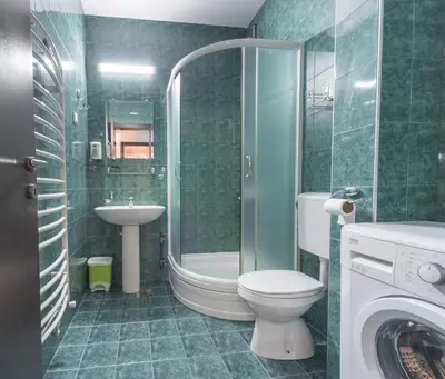 a bathroom with a toilet and a sink and a shower at R club Apartments Old Town Budva in Budva