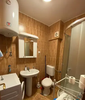 a bathroom with a toilet and a sink at Mint Apartment studio in Petrovac na Moru