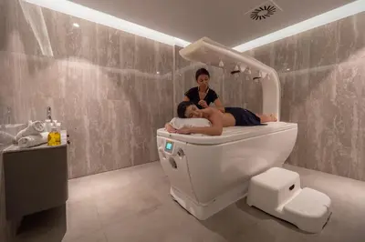 two people sitting on a toilet in a bathroom at Vivid Blue Serenity Resort in Sveti Stefan