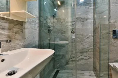 a bathroom with a sink and a shower at Montesun Boka Apartments in Budva