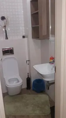 a bathroom with a toilet and a sink at City Apartment in Podgorica