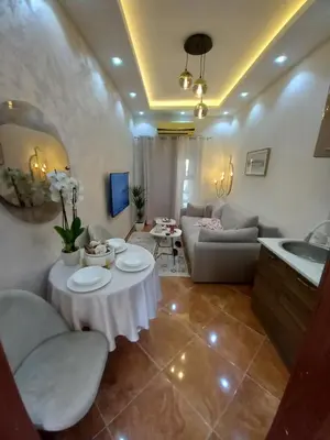 a living room with a couch and a table at Beach House in Petrovac na Moru