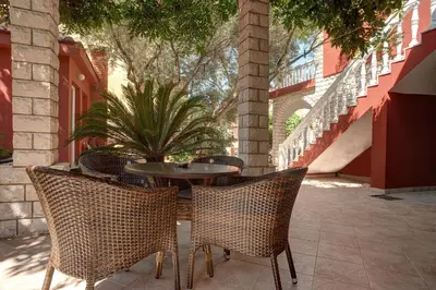 an outdoor patio with a table and chairs at Apartments Boreta II in Budva