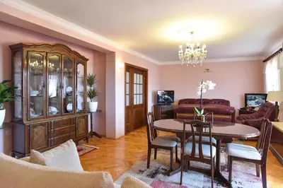 a living room with a table and a dining room at Vila Apartments Lidija in Petrovac na Moru