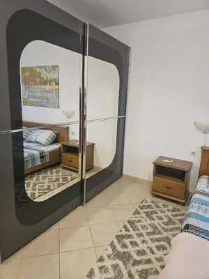 a large mirror in a bedroom with a bed at Villa Vi apartmen in a villa with a swimming pool in Bar