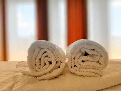 a roll of towels sitting on top of a table at Vila Uma in Bar