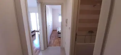 a hallway with a bathroom with a tub and a bathroom at Guest House Mikeli (BESPL. DORUCAK)-(FREE BREAKFAST) in Podgorica