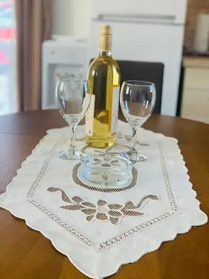 a bottle of wine and two wine glasses on a table at Gara 5 in Kotor