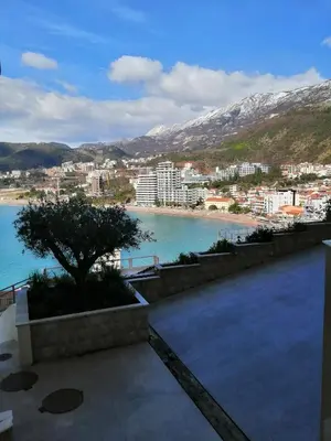a view of a city and a body of water at Apartman Sadutas in Rafailovici