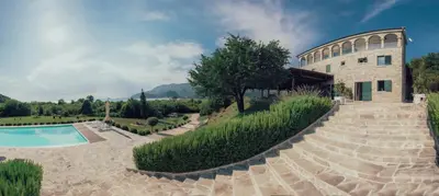 an external view of a villa with a swimming pool at MonteBay villa in Budva