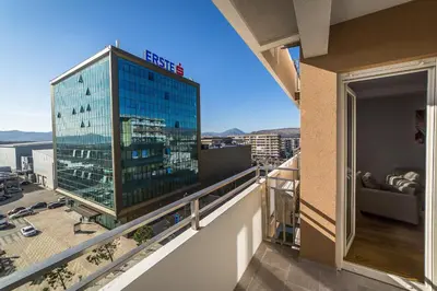 a view of a building from a balcony at Apartments Centrale 28 in Podgorica