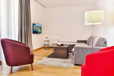 a living room with a couch and a table at Adriatic Dream - Sea View Apartments in Budva