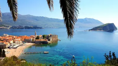 a view of a town on a body of water at Meric Duplex Apartment in Budva