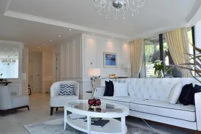 a living room with a white couch and a table at Boutique Hotel Vissi d'Arte in Budva