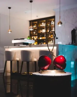 a table with two red balls on top of it at Boutique Hotel Vissi d'Arte in Budva