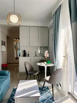 a kitchen and living room with a table and chairs at Anja apartment_City Center_ in Bar