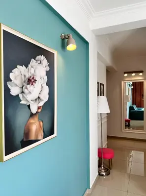 a painting of a vase with a flower on a wall at Anja apartment_City Center_ in Bar