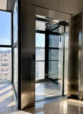 an elevator in a building with a view of a city at Anja apartment_City Center_ in Bar