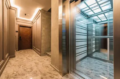 a hallway with a door and a glass ceiling at Dollaku Apartments in Bar