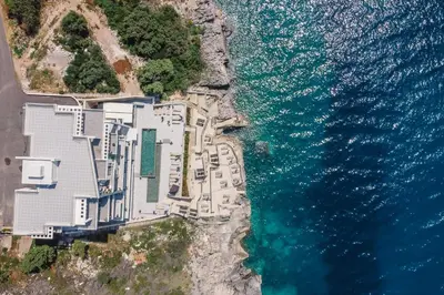 an aerial view of a building next to the ocean at Dollaku Apartments in Bar