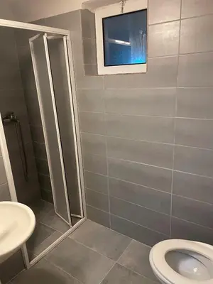 a bathroom with a toilet and a sink at SARA BUDVA in Budva