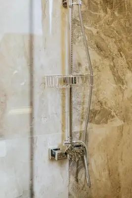 a shower in a bathroom with a metal rack at AM Palace in Ulcinj