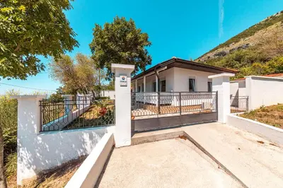 a house with a gate and a fence at Holiday Home Marija in Budva