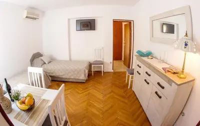 a room with a kitchen and a living room at Apartments Angela in Budva